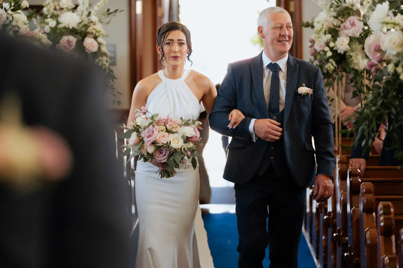 Bride tries to hold it together up the aisle