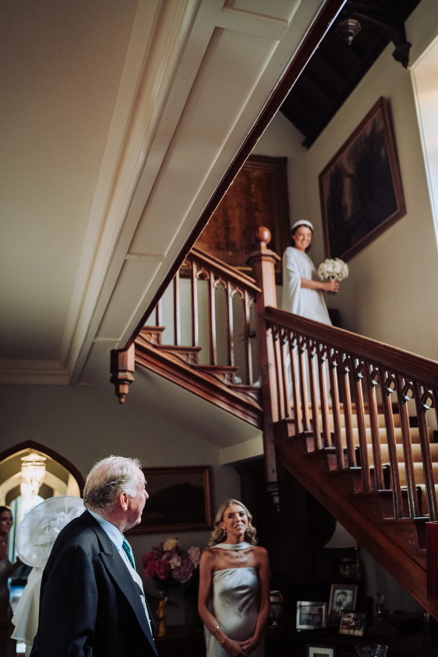 Fob watches bride descend stairs