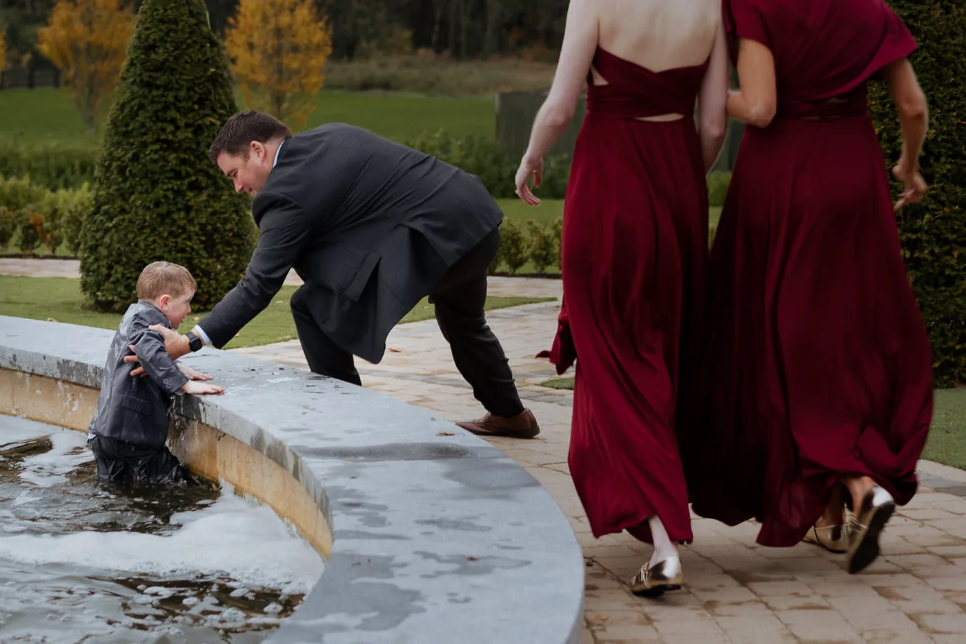Pageboy falls in fountain