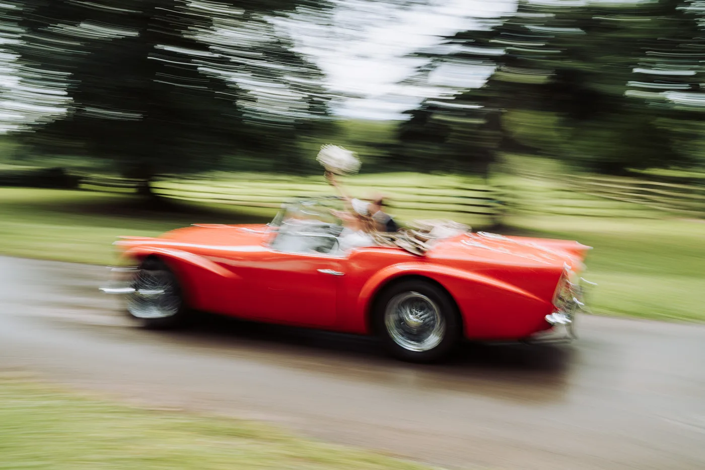Vintage red wedding car motion blur