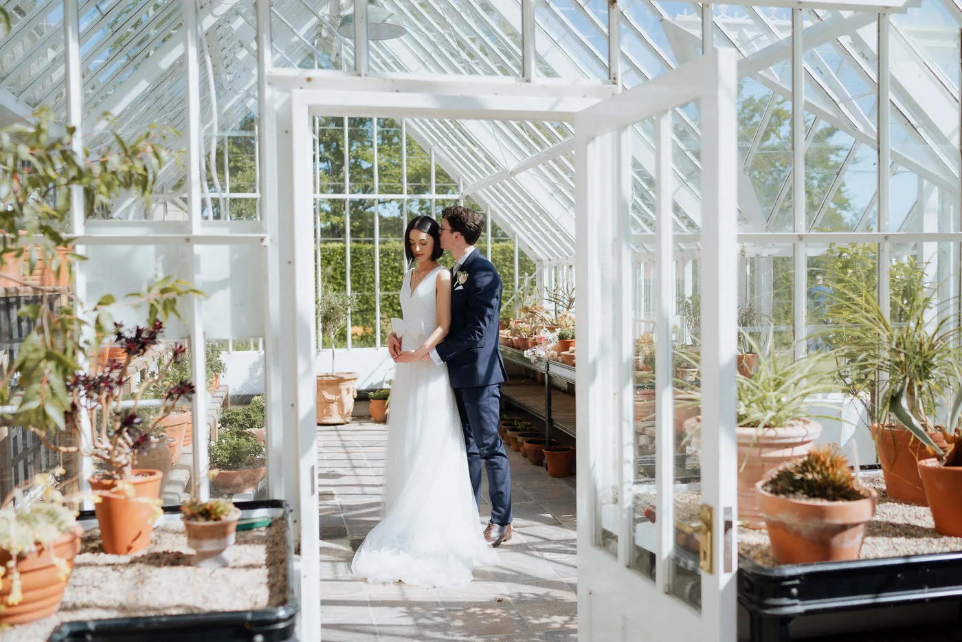 Couple snuggle in glasshouse carriage rooms montalto