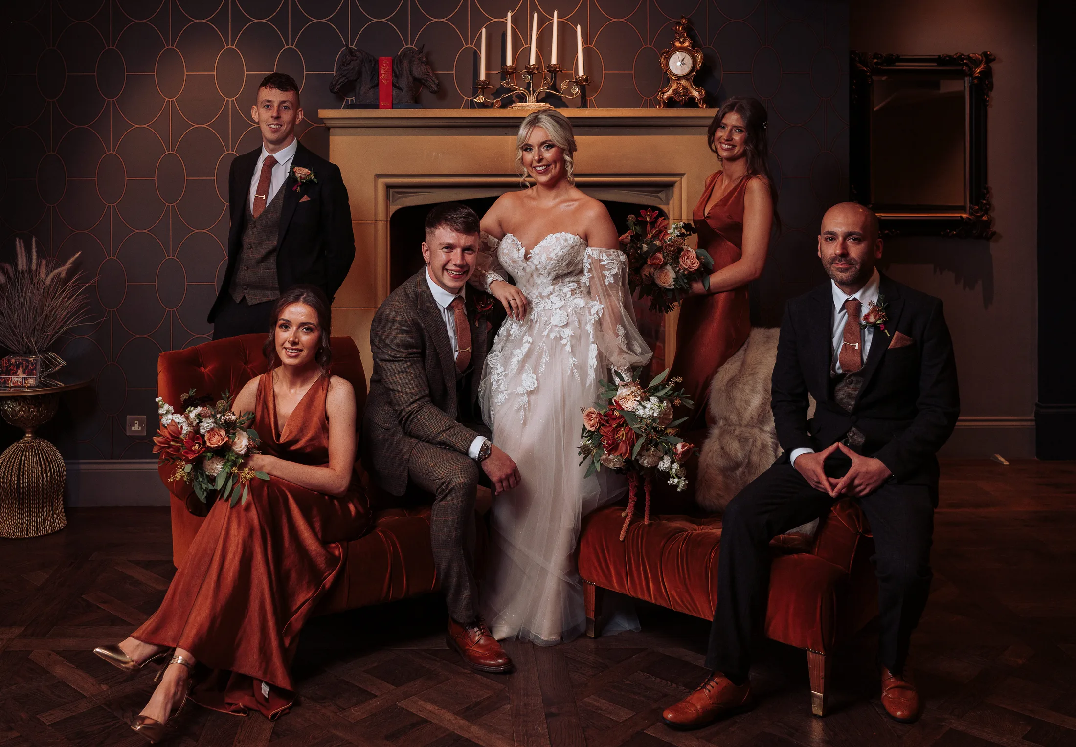 Bridal party fireplace autumn colours clandeboye lodge