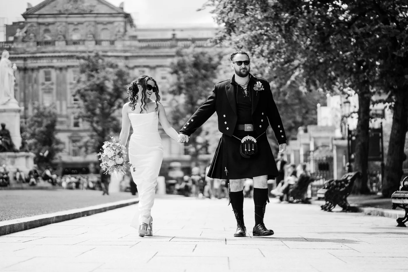 Bride and groom walking at belfast city hall