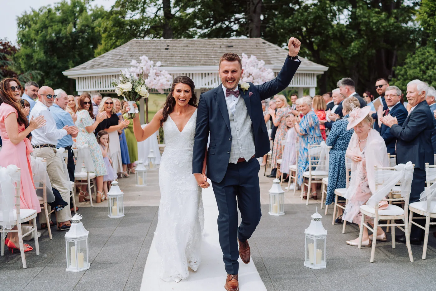 Bride and groom by the lake at Roe Park Resort